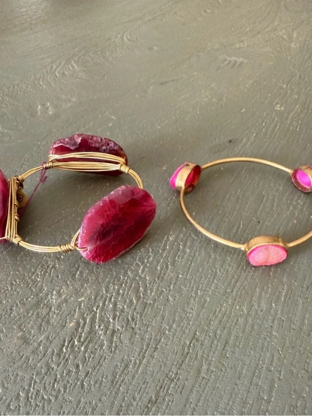 Two pink and gold bracelets